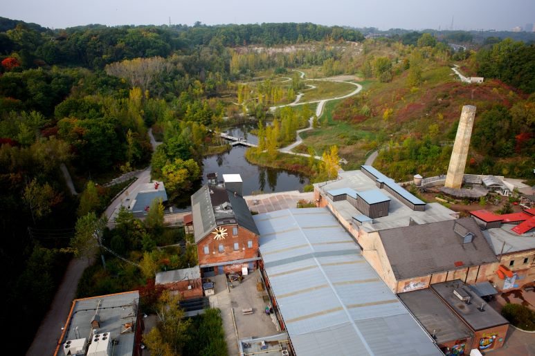 Drone shot of Evergreen Brick Works, overview of an old brick factory and quarry restored as a parc