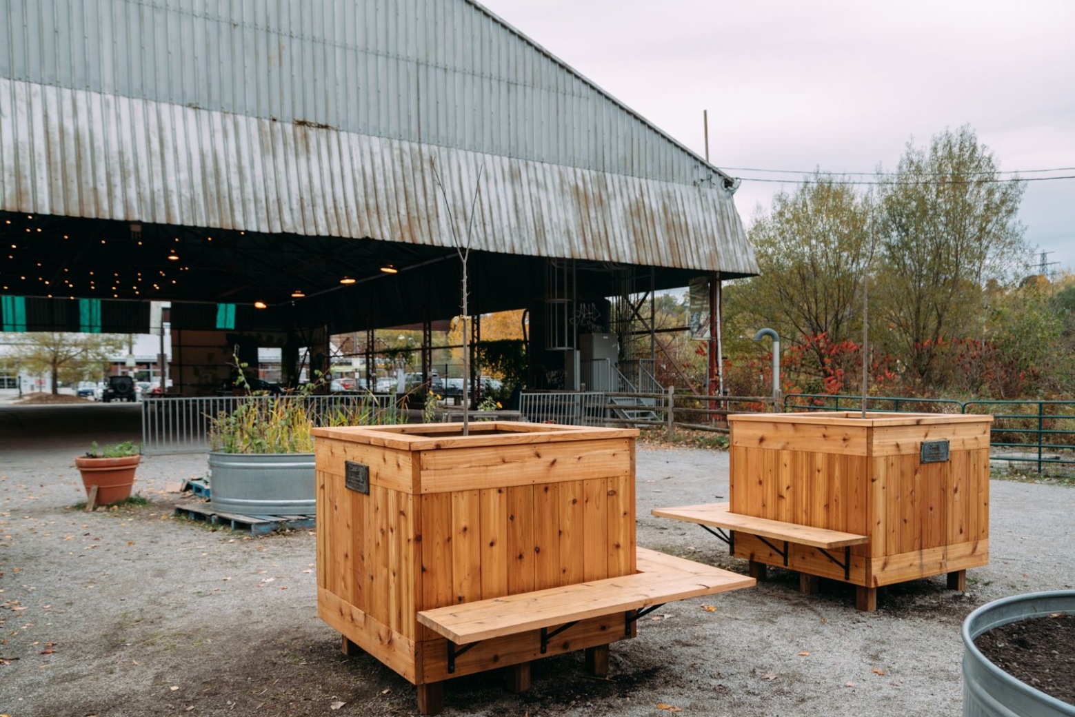 Cedar garden boxes on display outdoors.