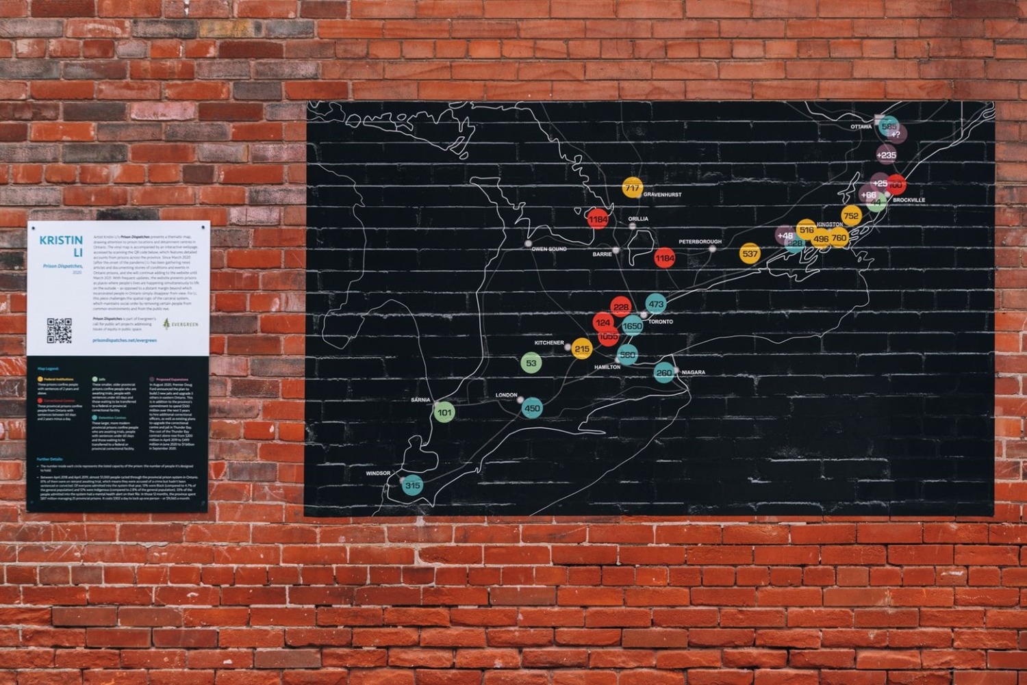 Art piece of a map of Ontario on a brick wall.