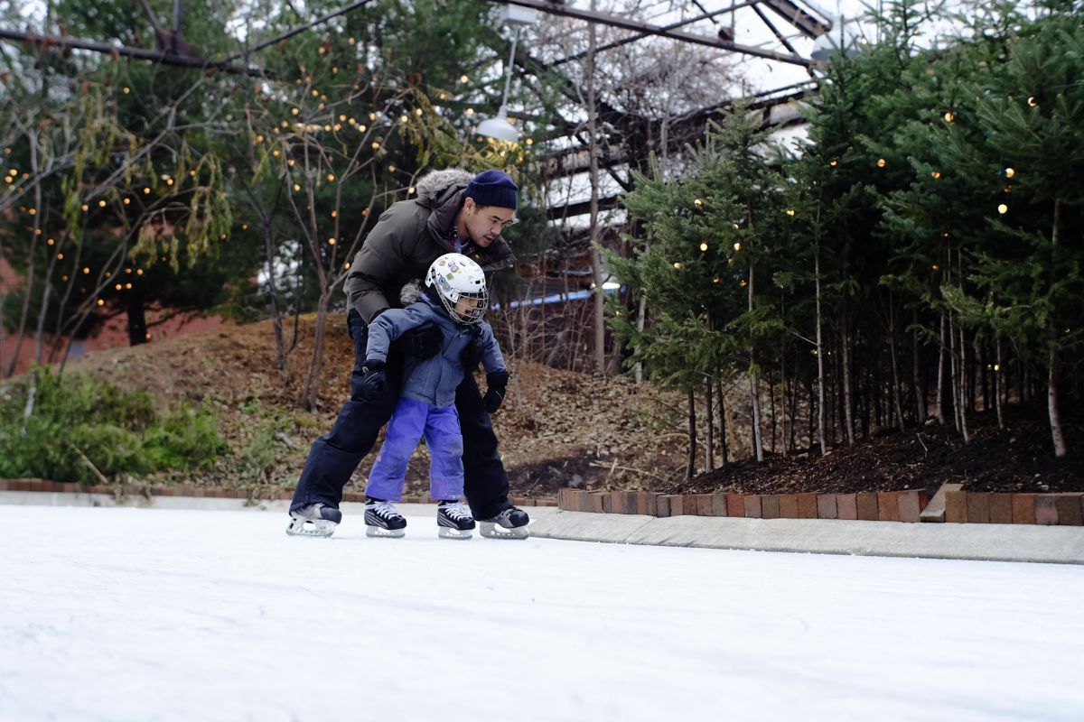 Parent and tot learn to skate at the Brick Works