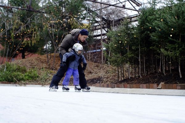Parent and tot learn to skate at the Brick Works
