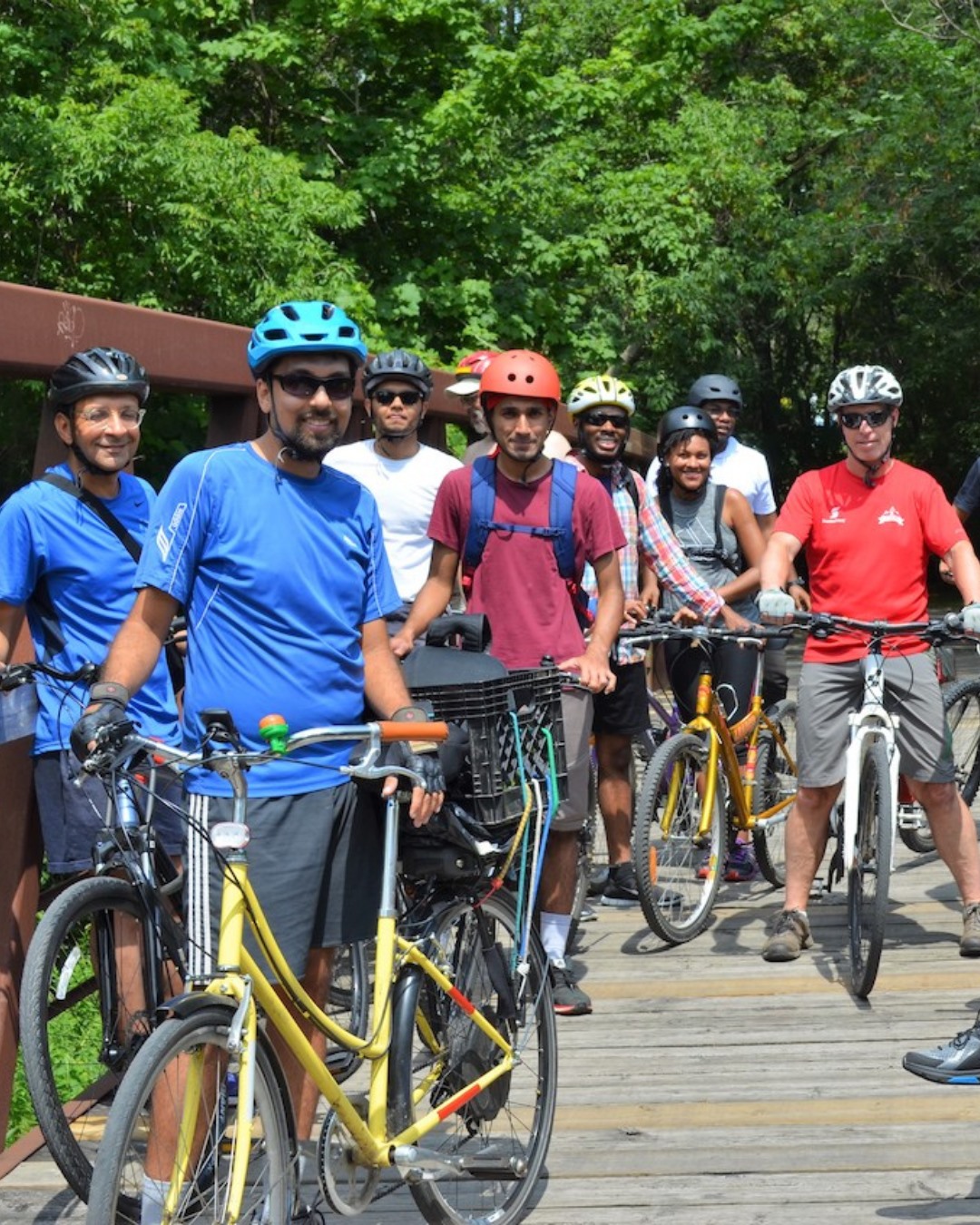 Group of people standing with bikes