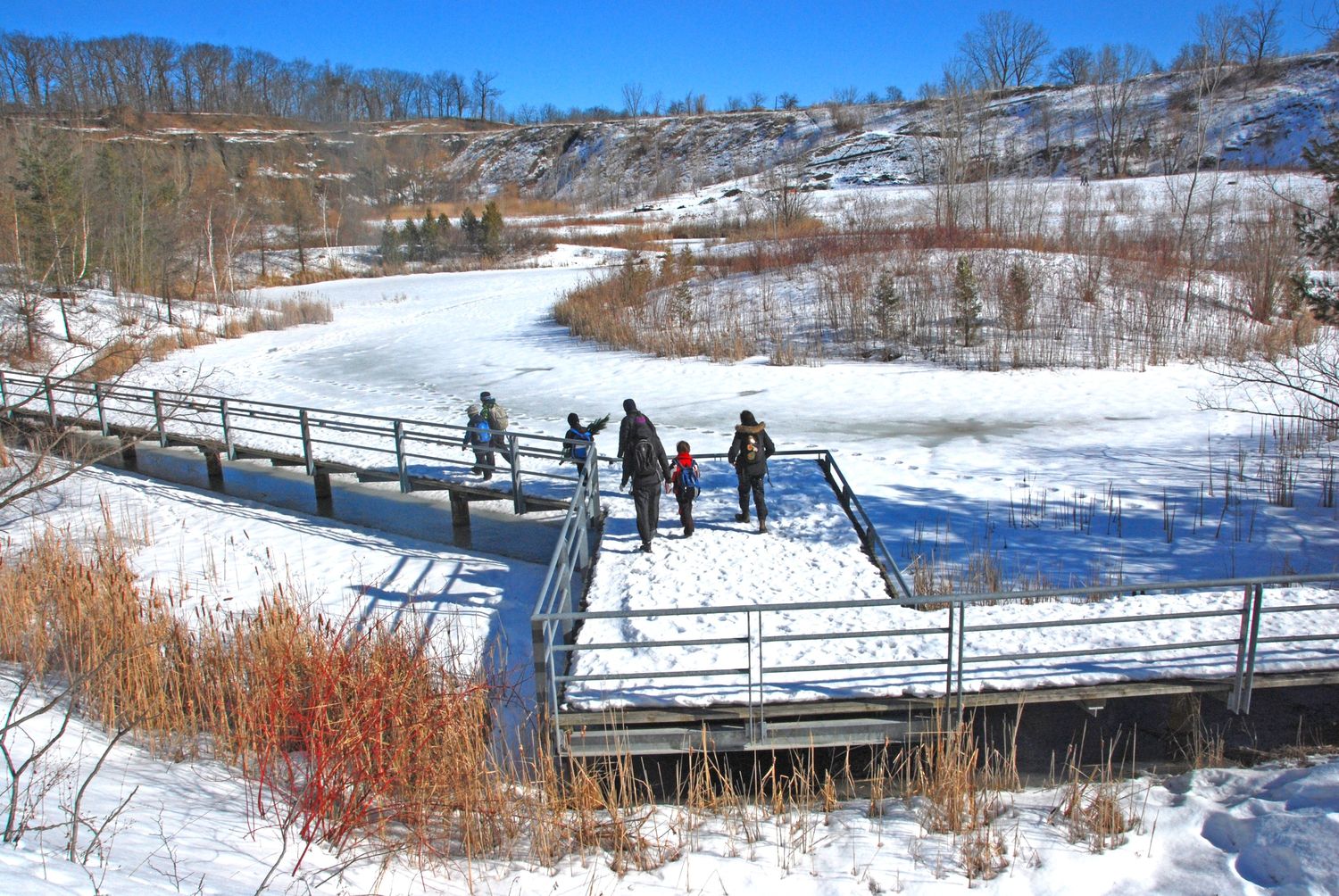 People hiking on trail in the snow