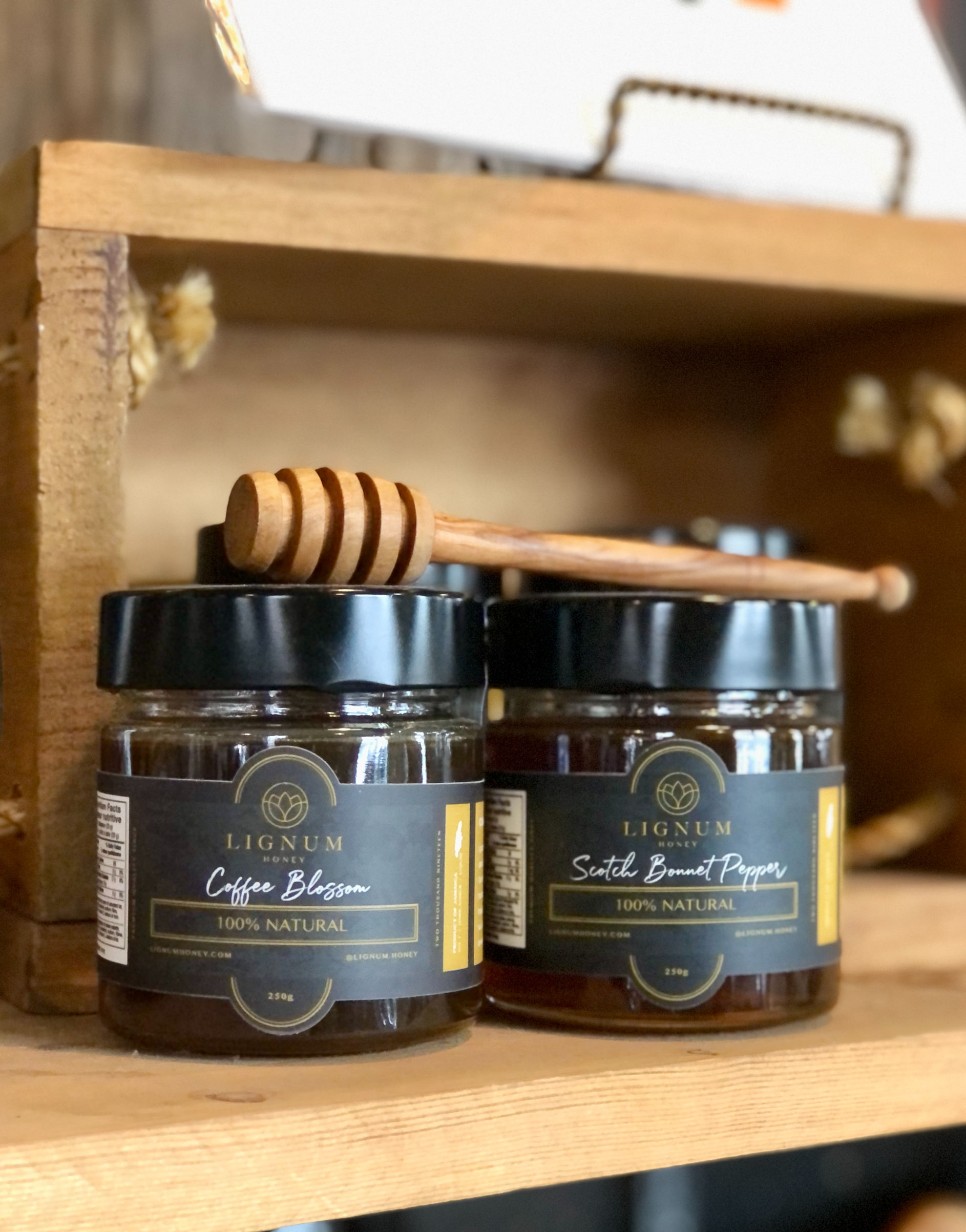 Two jars of Lignum Honey on the shelf at the Evergreen Garden Market