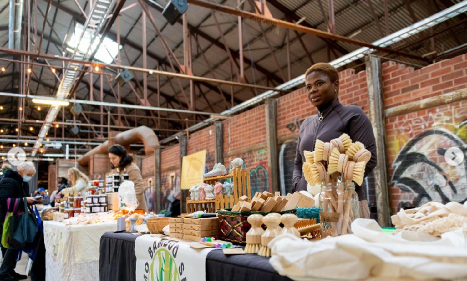 Omo Bamboo table displaying eco-friendly home goods at the Saturday Farmers Market