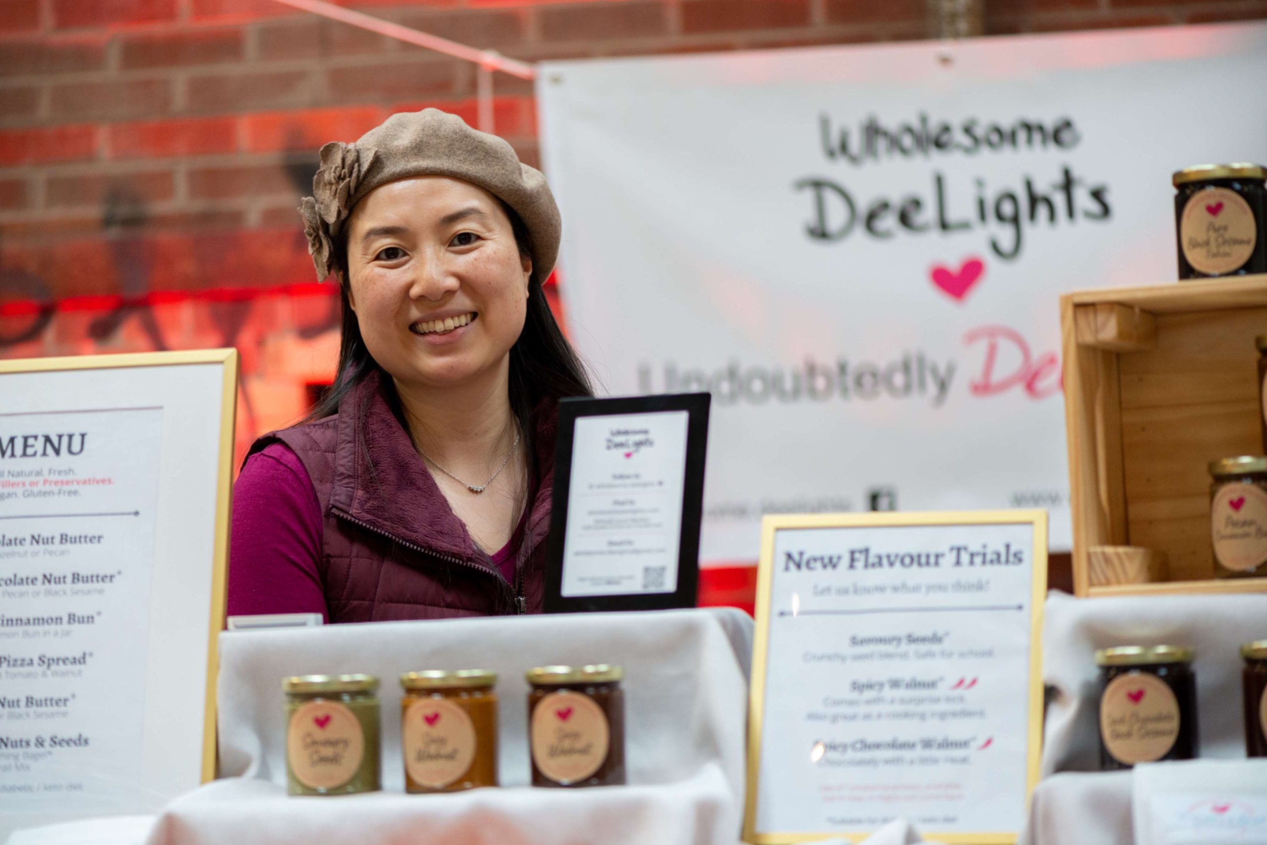 Vendor standing with her products at the Farmers Market