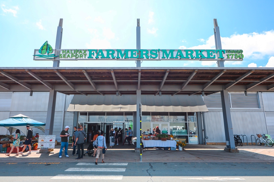 People walking into market building