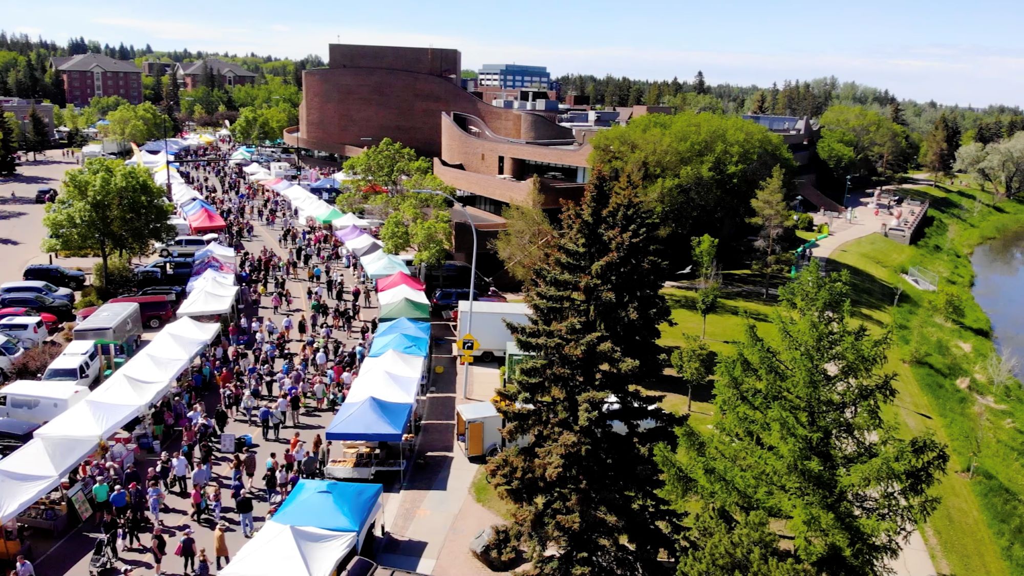 ariel photo of street lined with vendors for public market