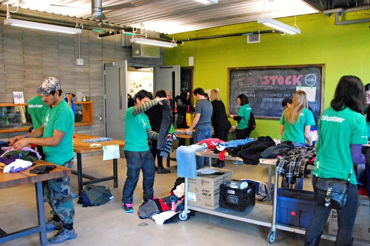 Volunteers folding donated clothes 