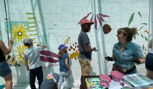 community painting mural in the Garden Market with Julia Prajza. 