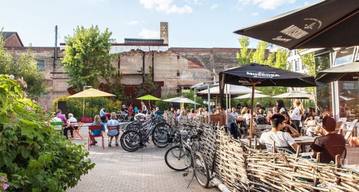 People enjoying the restaurant patio at Evergreen Brick Works