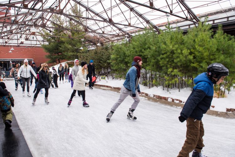 people skating at Evergreen Brick Works in the winter