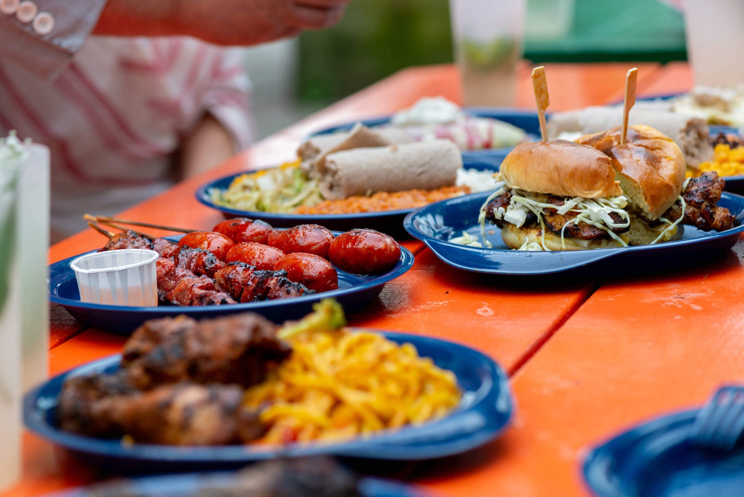 Any array of different cuisines from Evergreen’s Outdoor Eats on reusable dishware. Photo credit: Al Yoshiki 