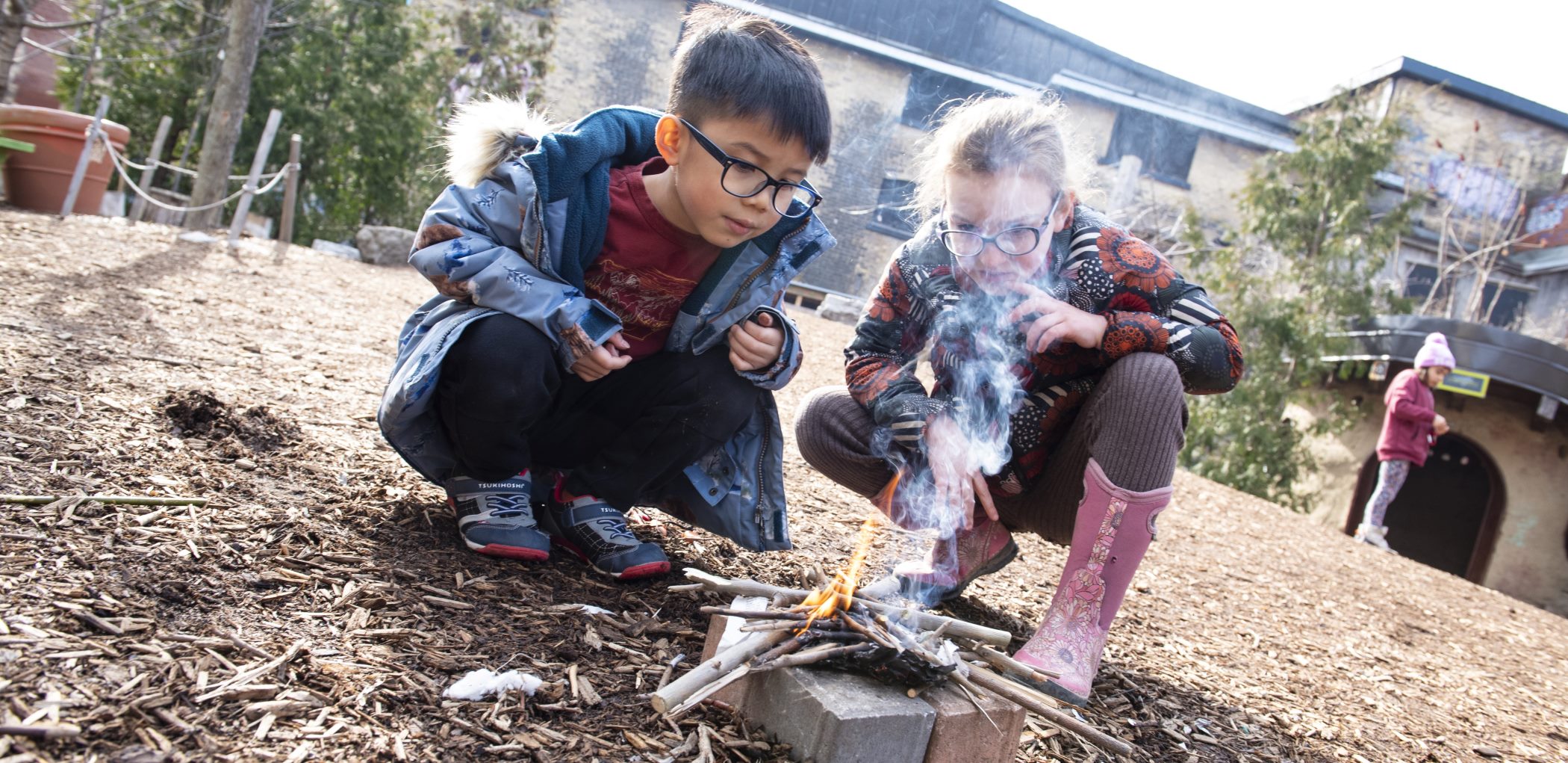 Kids building fire at March Break Camp