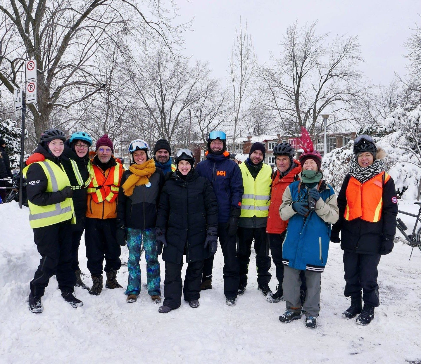 group of person in winter with bikes in the background