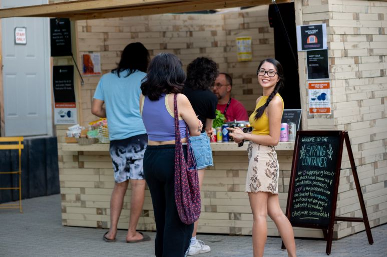Young people line up to get some food