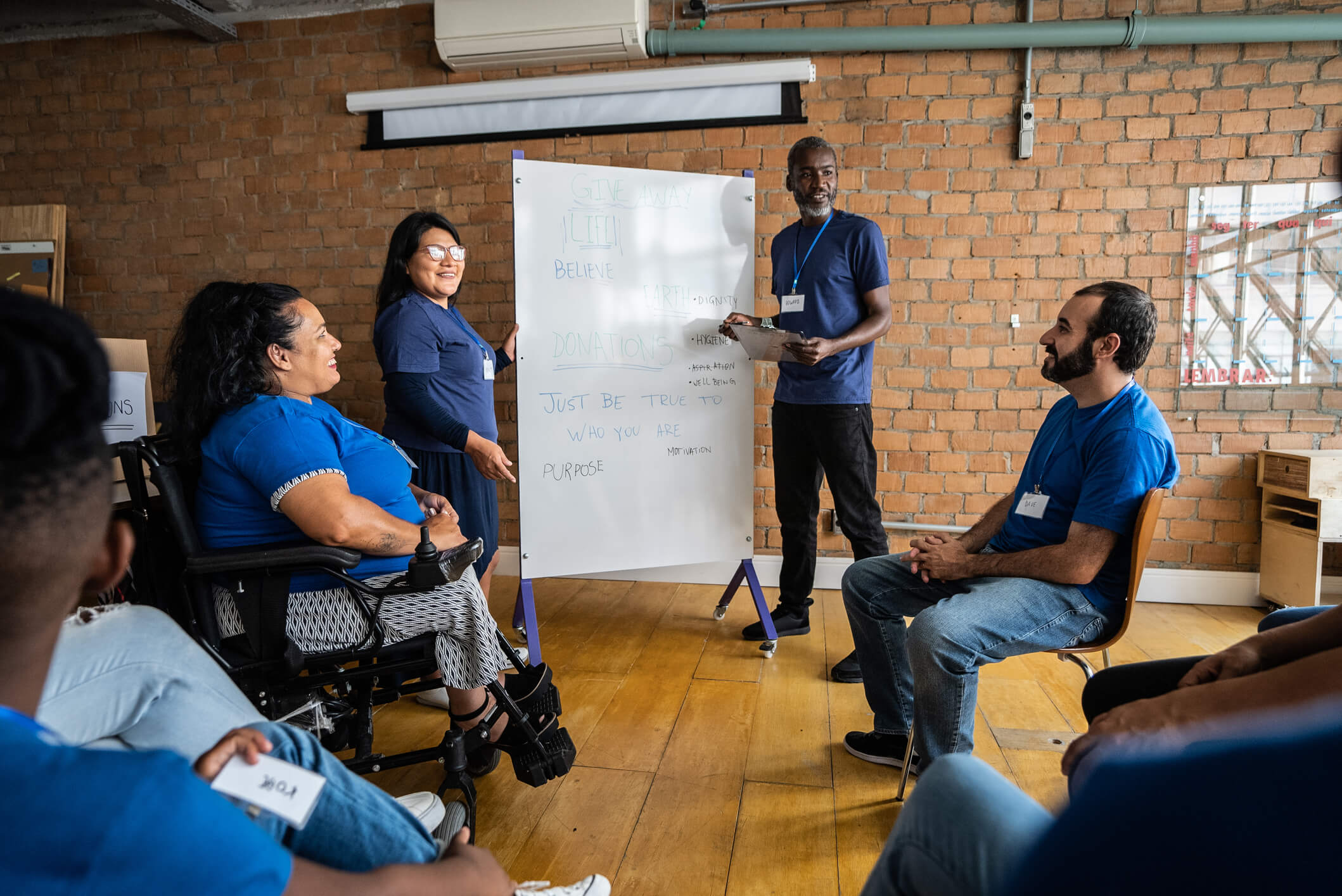 Group of people in a workshop talking