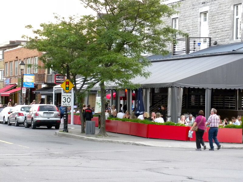 Street with cars and pedestrians in Longueuil Quebec